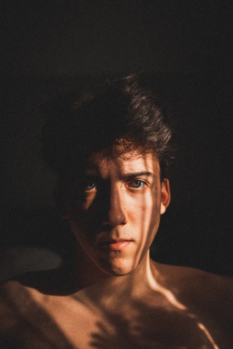 Golden hour lighting on a man with strong shadows
