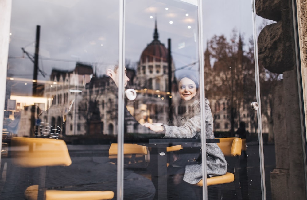 smiling woman sitting on chair