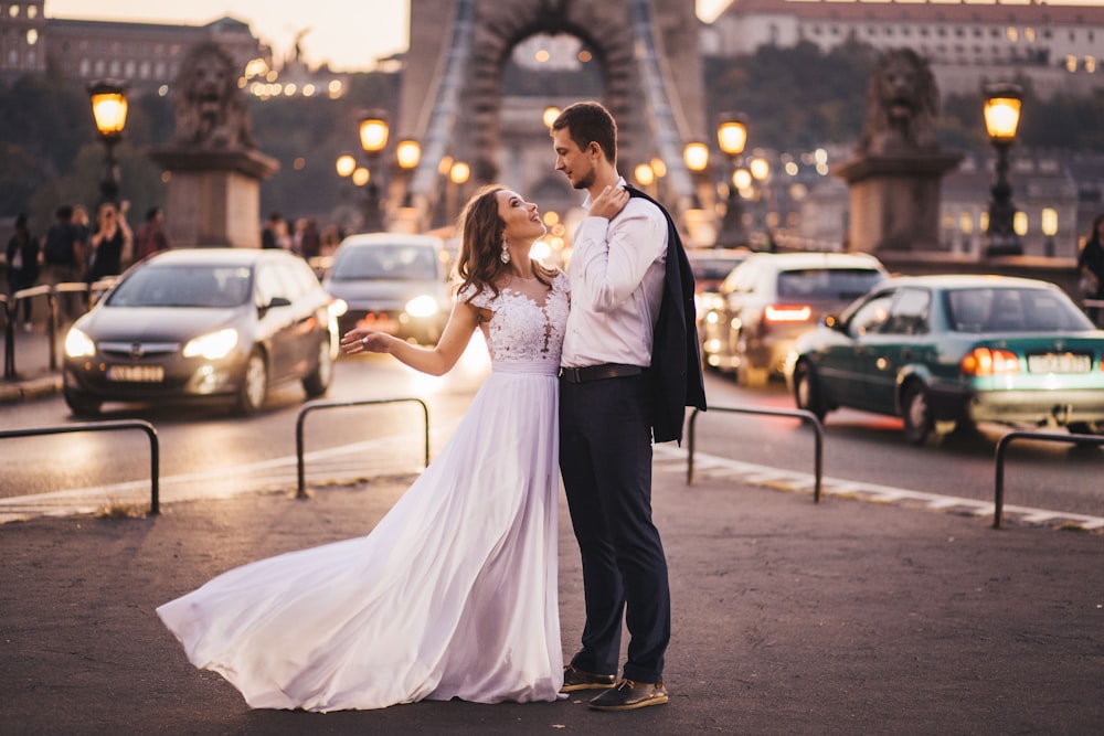 newly wed standing on street during day time