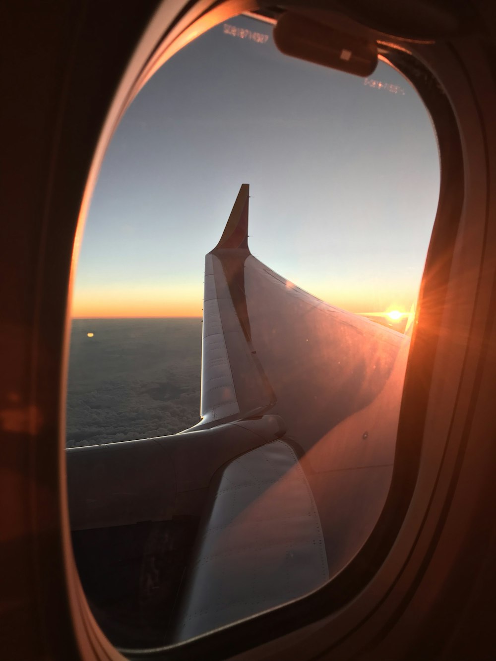 gray airplane window during daytime