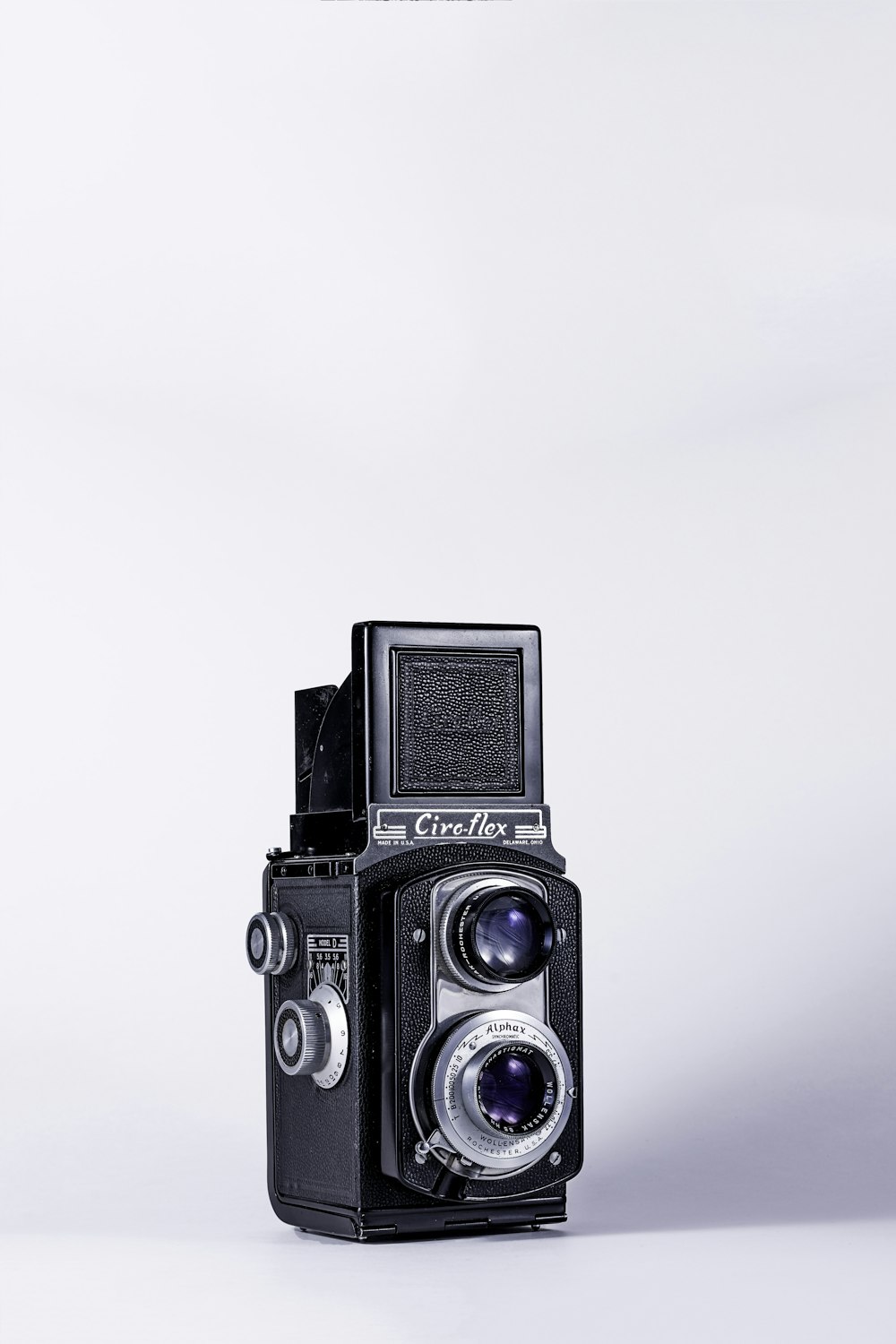 black and gray camera on white surface