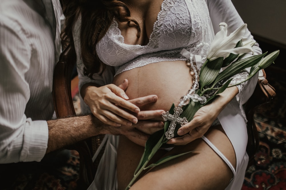 man touching woman's tummy