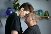 couple standing near floating shelf