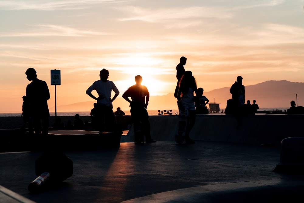 silhouette of people at the skate ramp