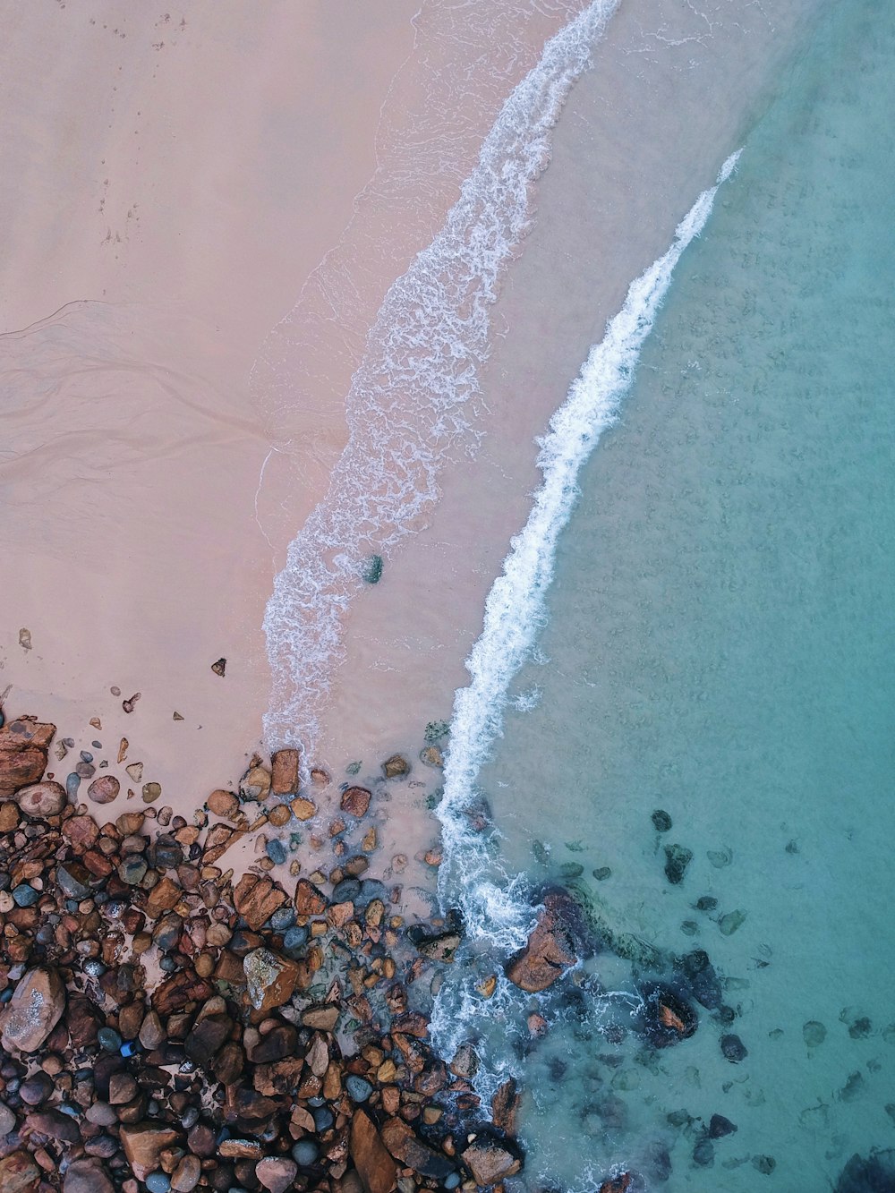 aerial view photography of stones on seashores