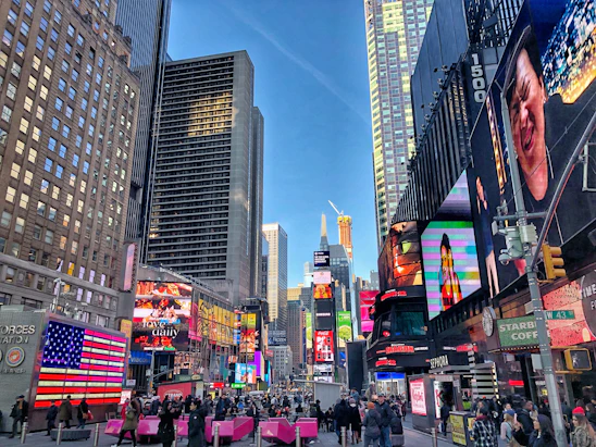 A bustling Los Angeles skyline with towering highrises and business professionals analyzing charts on digital devices.
