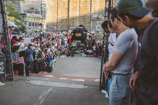 A vibrant skateboarding event with spectators cheering.