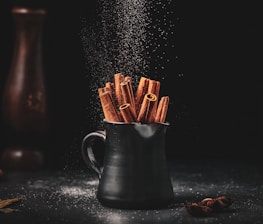 black ceramic jar on black surface