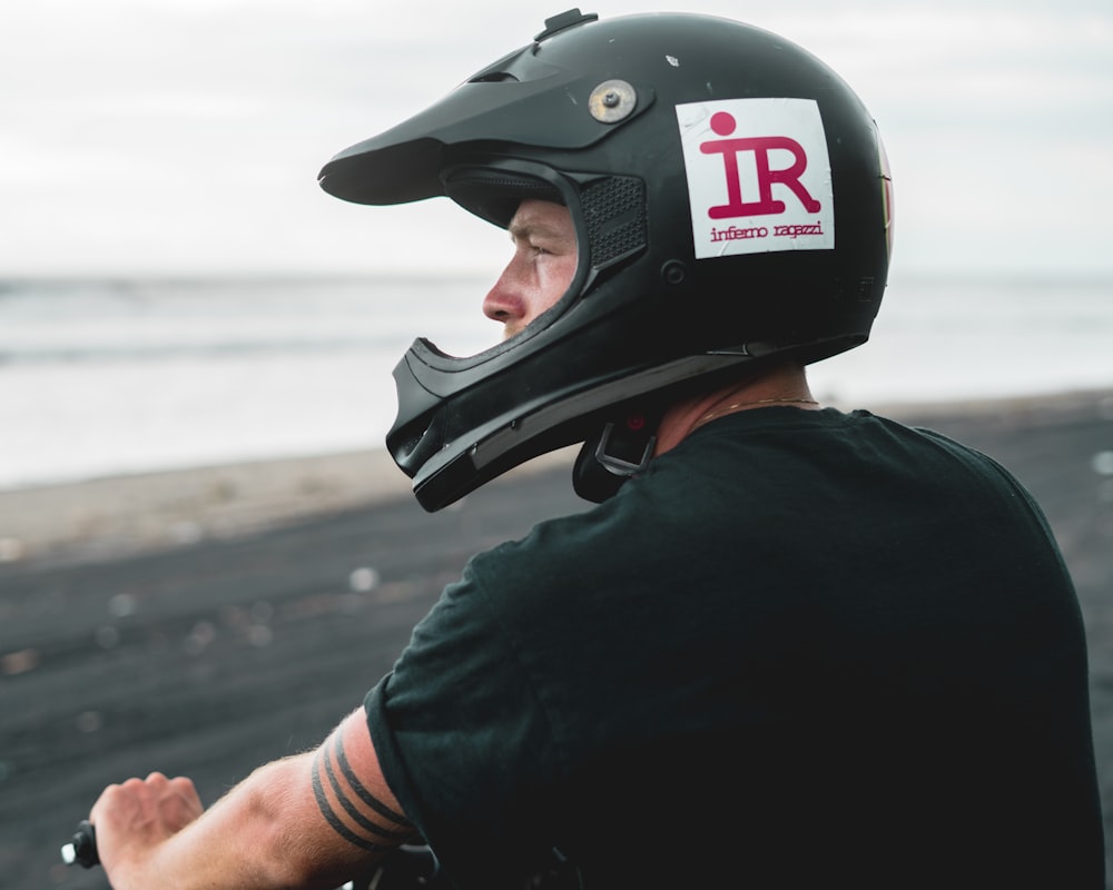 man wearing black motocross helmet