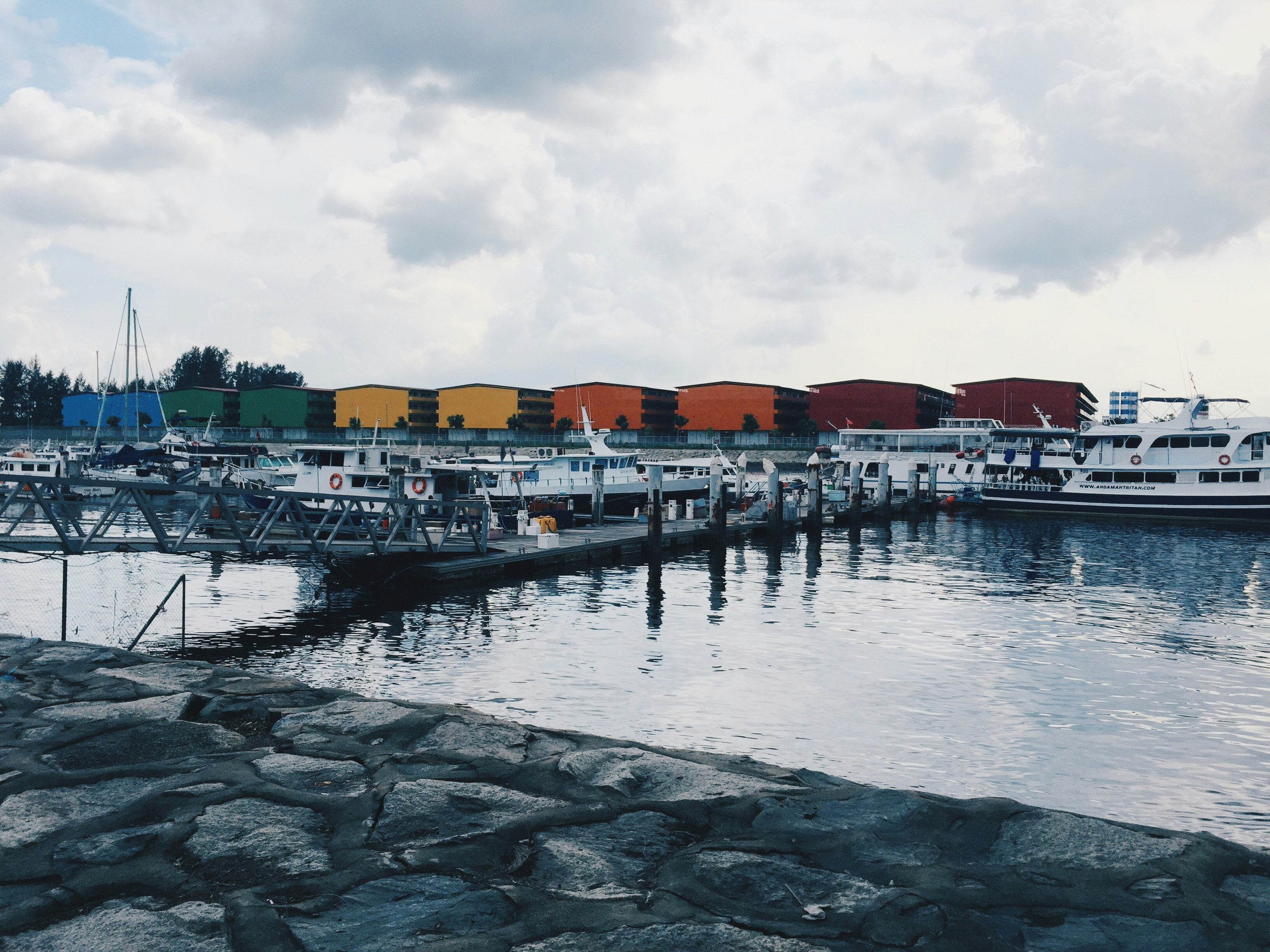 white motorboats at water during daytime