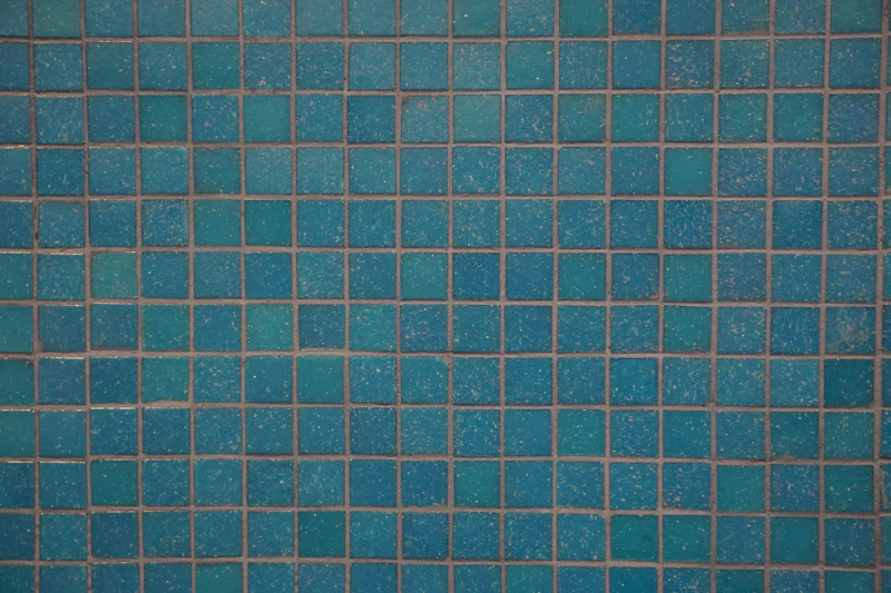 Sparkling tile at the waterline of a freshly serviced pool