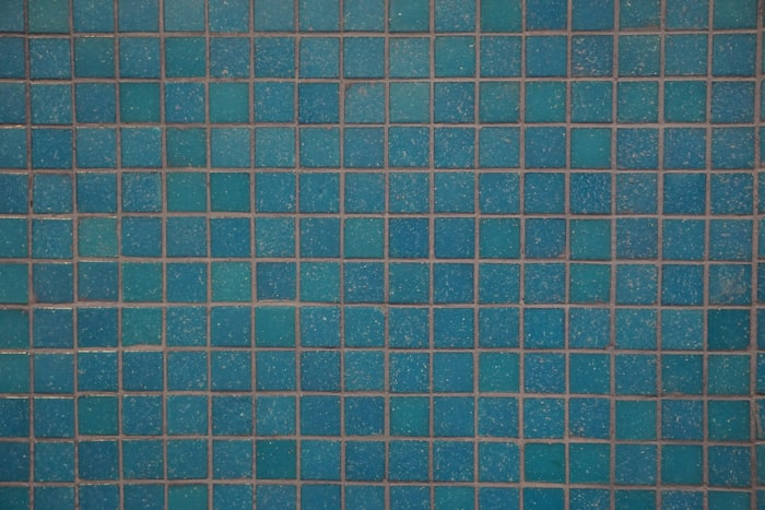 Dull, calcium-clouded waterline tile before treatment