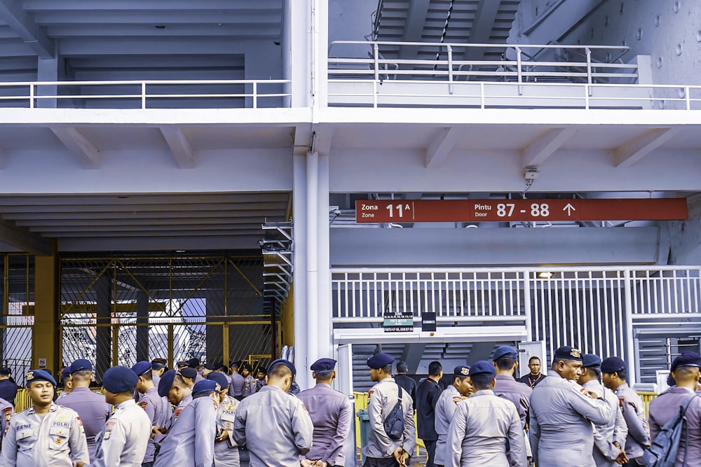 men standing near white building