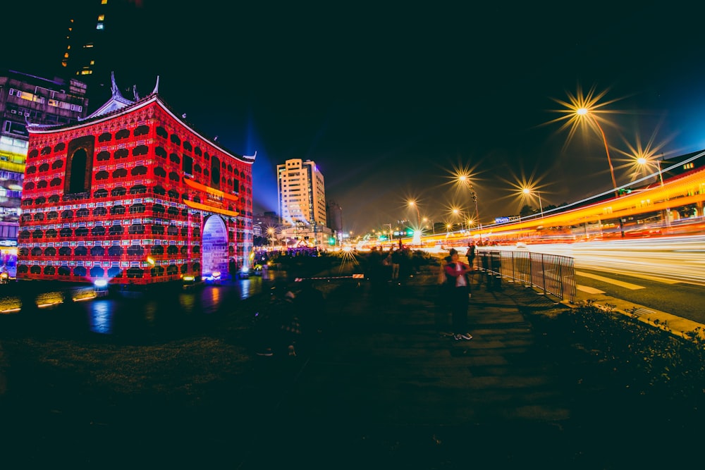 red concrete building during night time