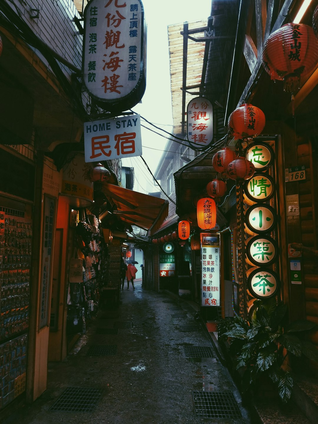 orange ball lamp hanging across streets