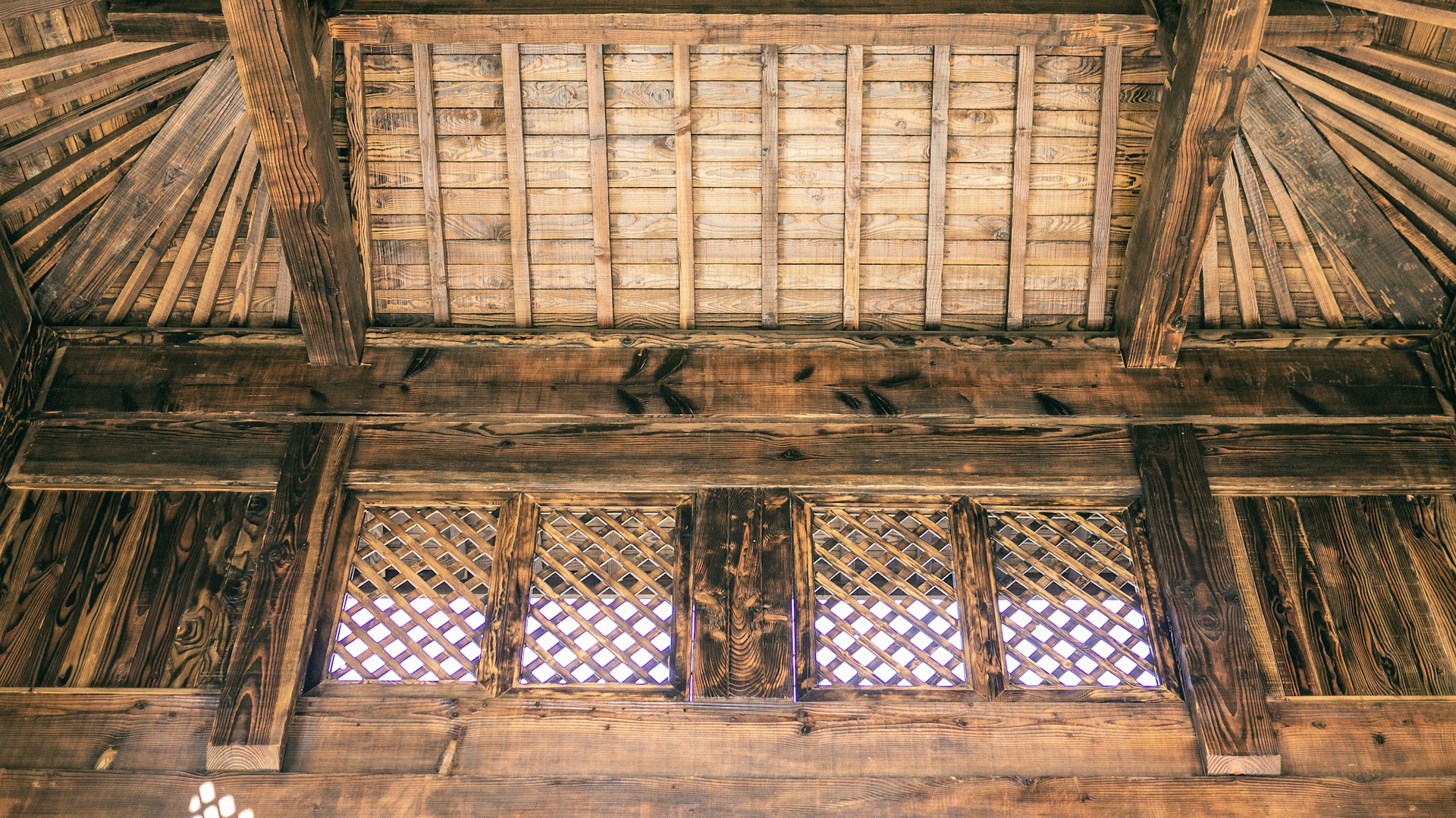woman wearing yellow long-sleeved dress under white clouds and blue sky during daytime