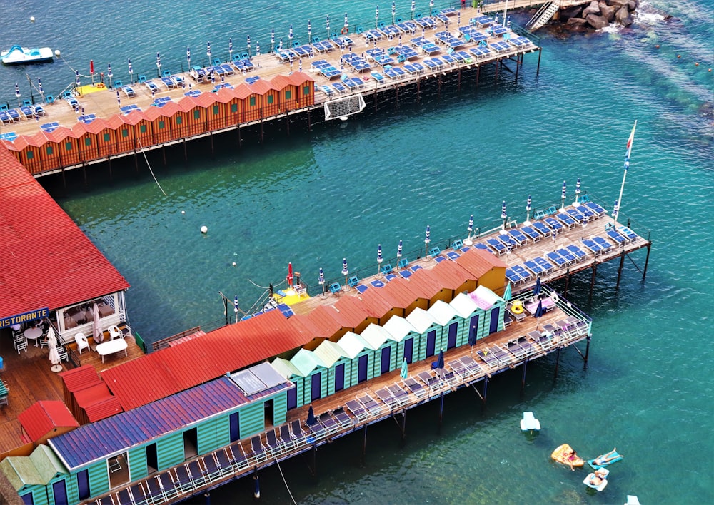 houses and docks on body of water during daytime