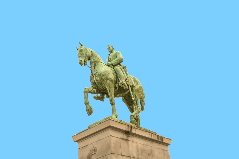 man riding on horse statue