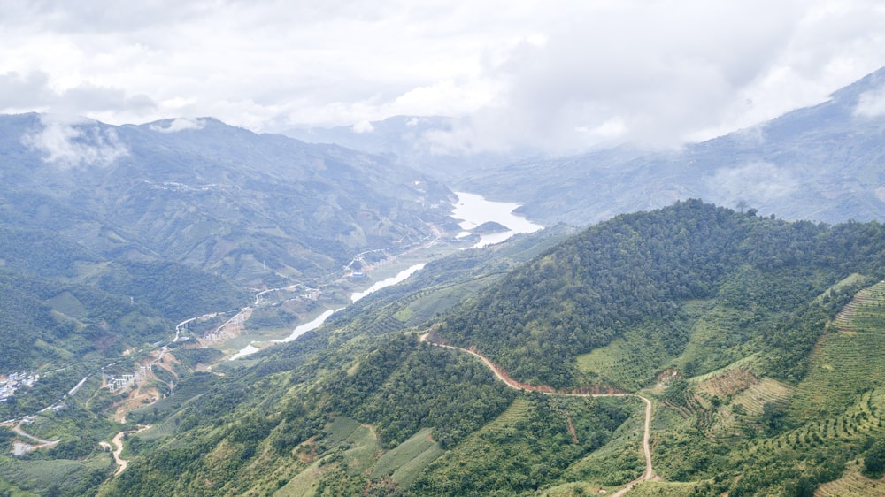 green mountains under white clouds during daytime