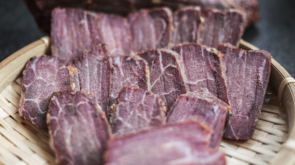 selective focus photography of pink foods on brown wicker bowl