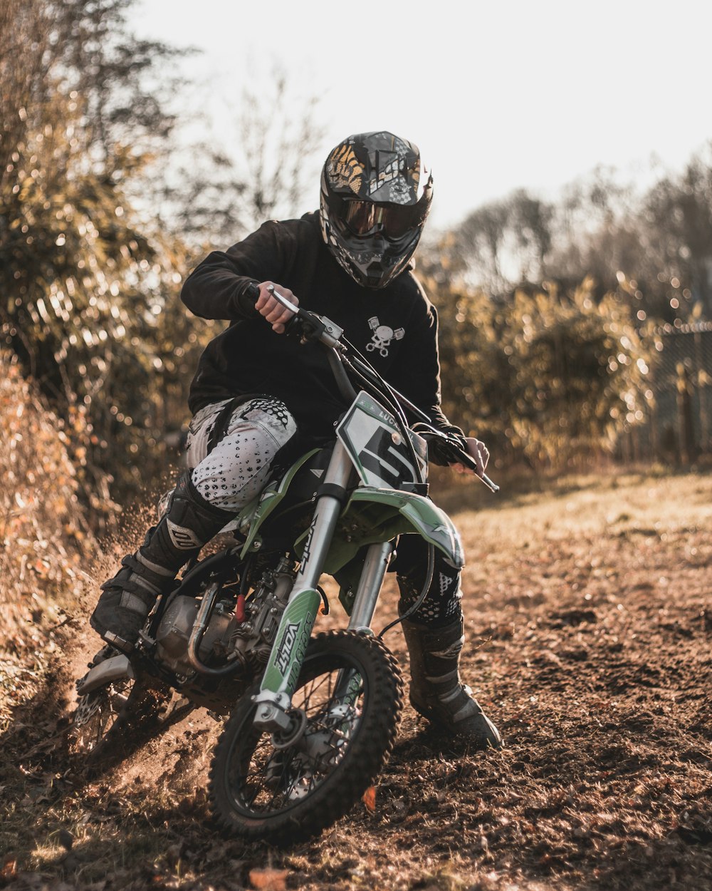 man riding dirt bike during daytime