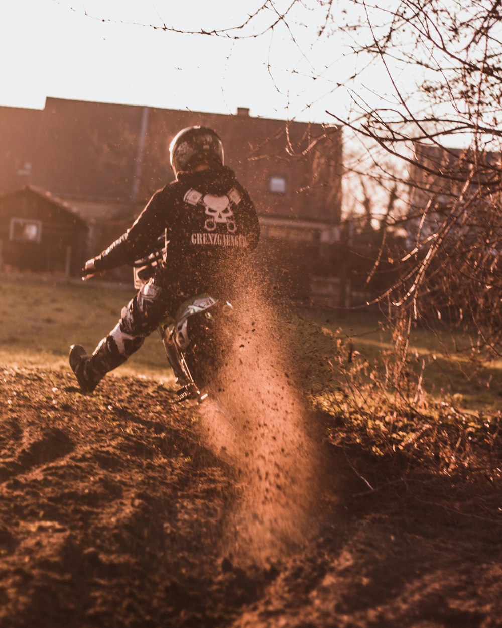 person riding dirt bike during daytime