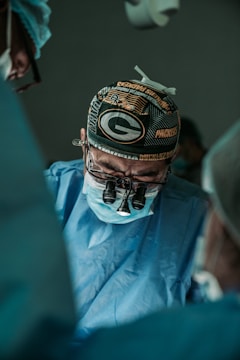 doctor wearing Green Bay Packers hat