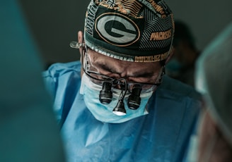 doctor wearing Green Bay Packers hat