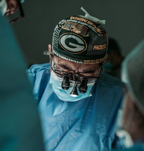 doctor wearing Green Bay Packers hat