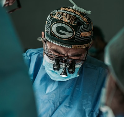 doctor wearing Green Bay Packers hat