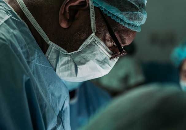 man wearing medical mask and robe