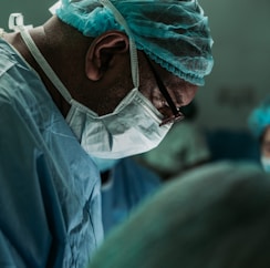 man wearing medical mask and robe