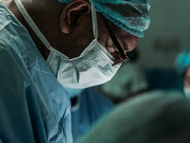 man wearing medical mask and robe