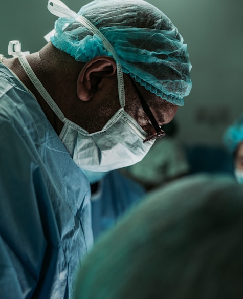 man wearing medical mask and robe