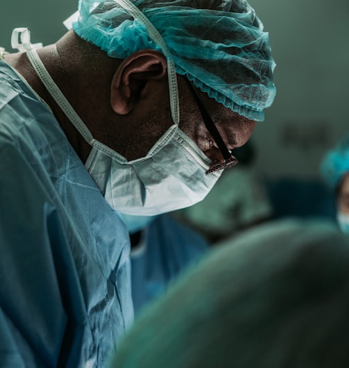 man wearing medical mask and robe