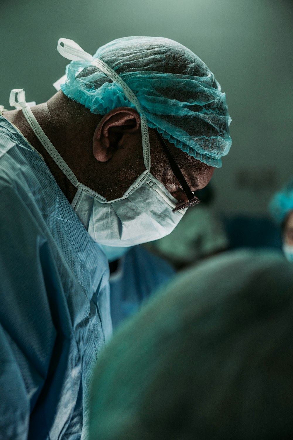 man wearing medical mask and robe