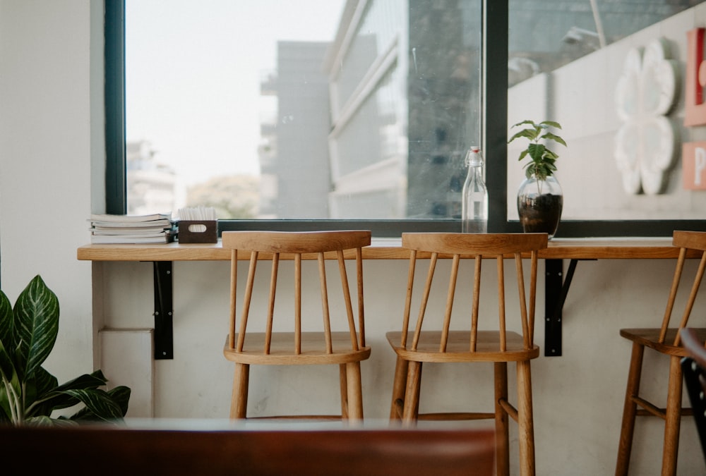 two brown wooden chairs