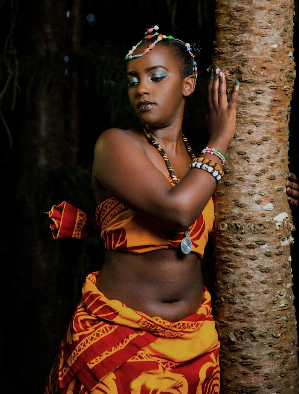 woman standing beside tree