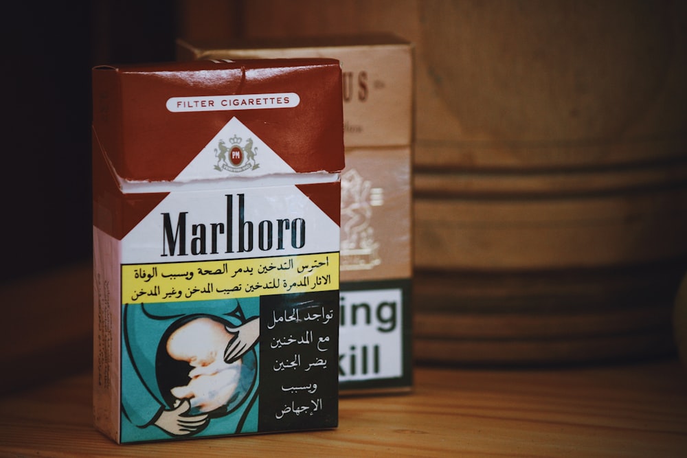 Marlboro flip-top cigarette box on wooden surface