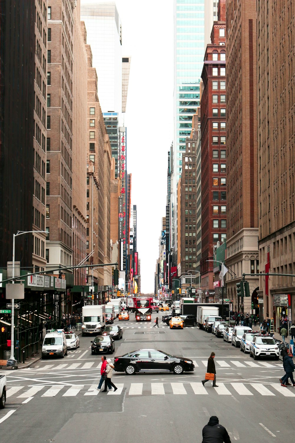 car on road near high-rise buildings