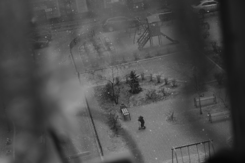 grayscale photography of person skating on ground