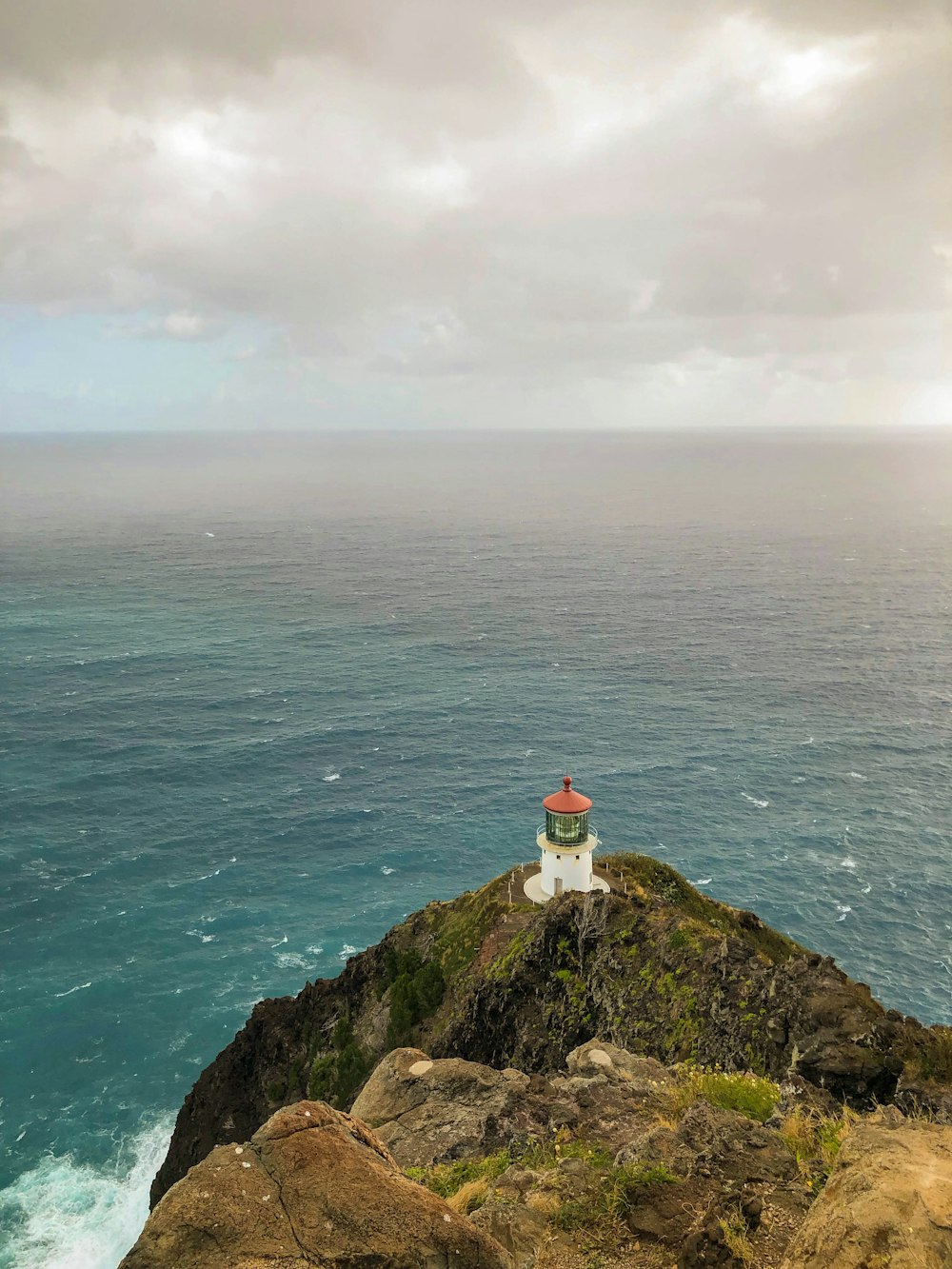 aerial photography of white and brown lighthouse