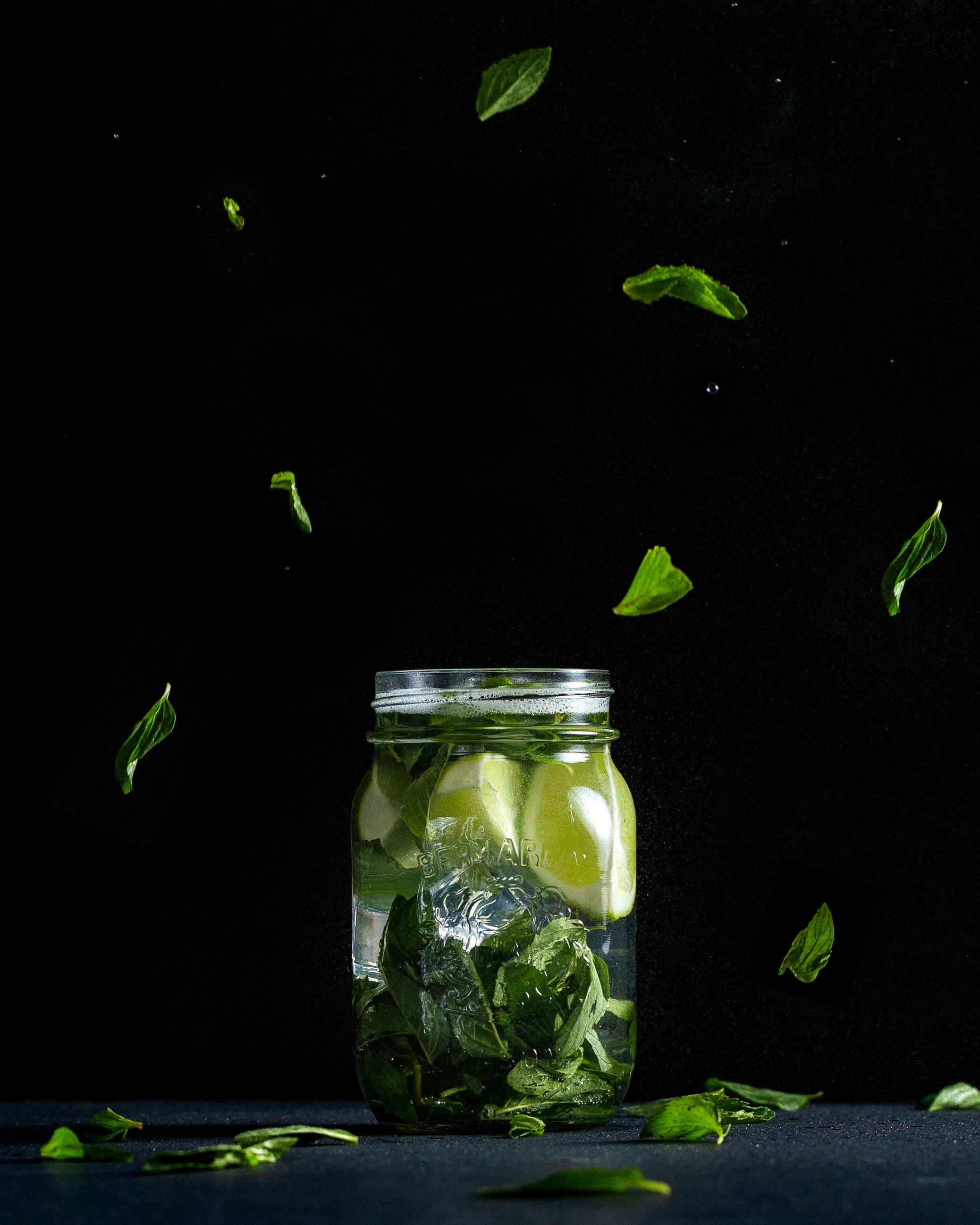 sliced lime in clear glass jar