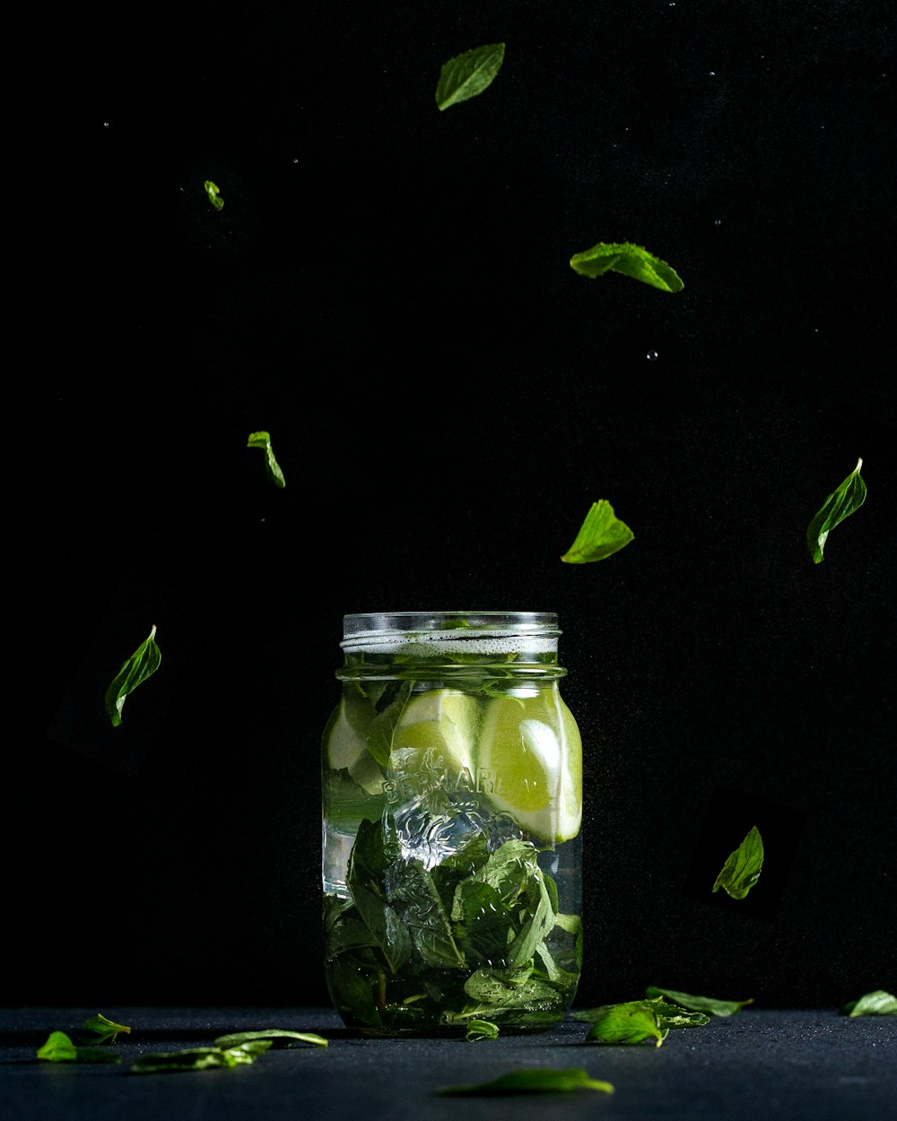sliced lime in clear glass jar