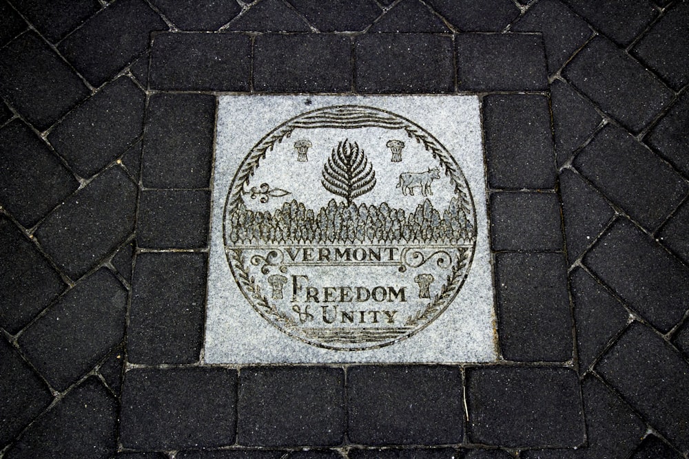 a plaque on the ground that says vermont