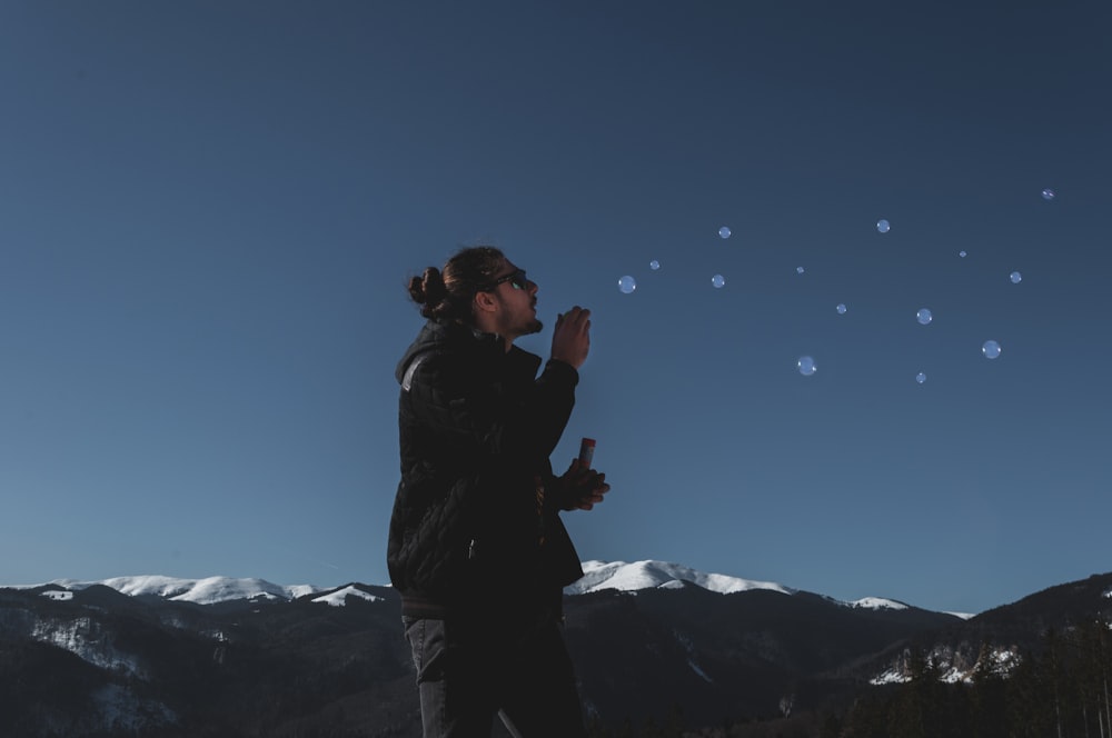 man playing with bubbles