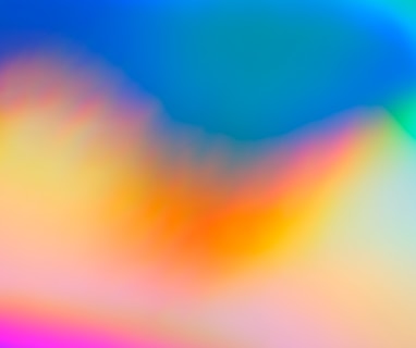 a blurry image of a rainbow colored background