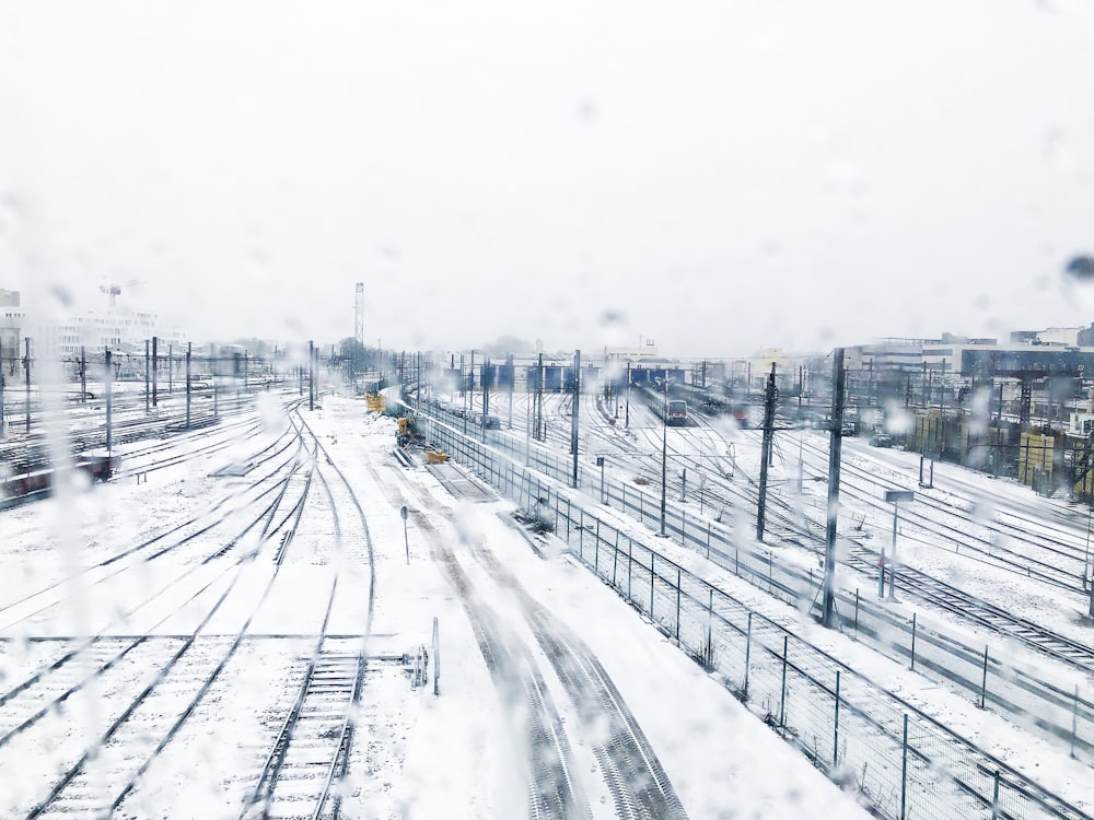 snow covered railway during daytime