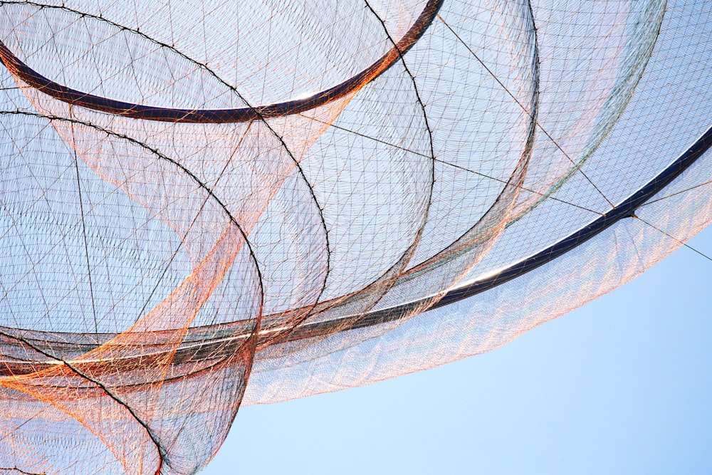 brown and gray metal spiral building structure during daytime