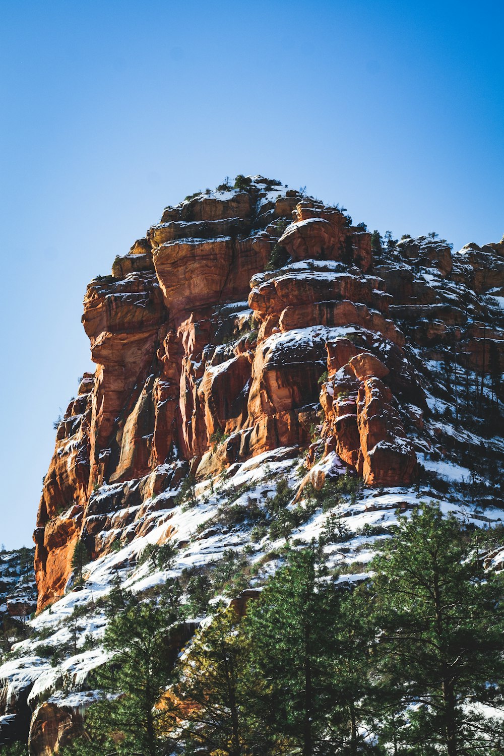 snow covered brown mountain during daytime